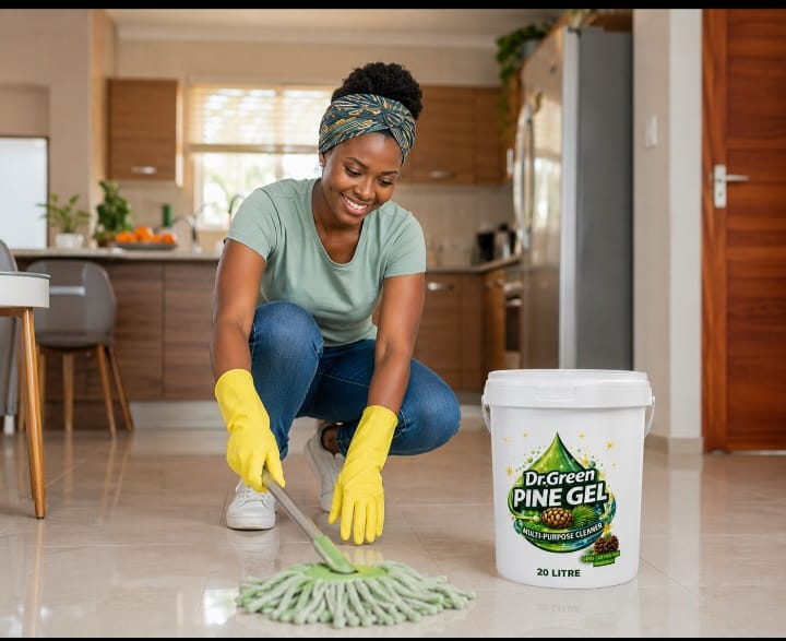 Woman mopping a kitchen floor with Dr Green Pine Gel 20L